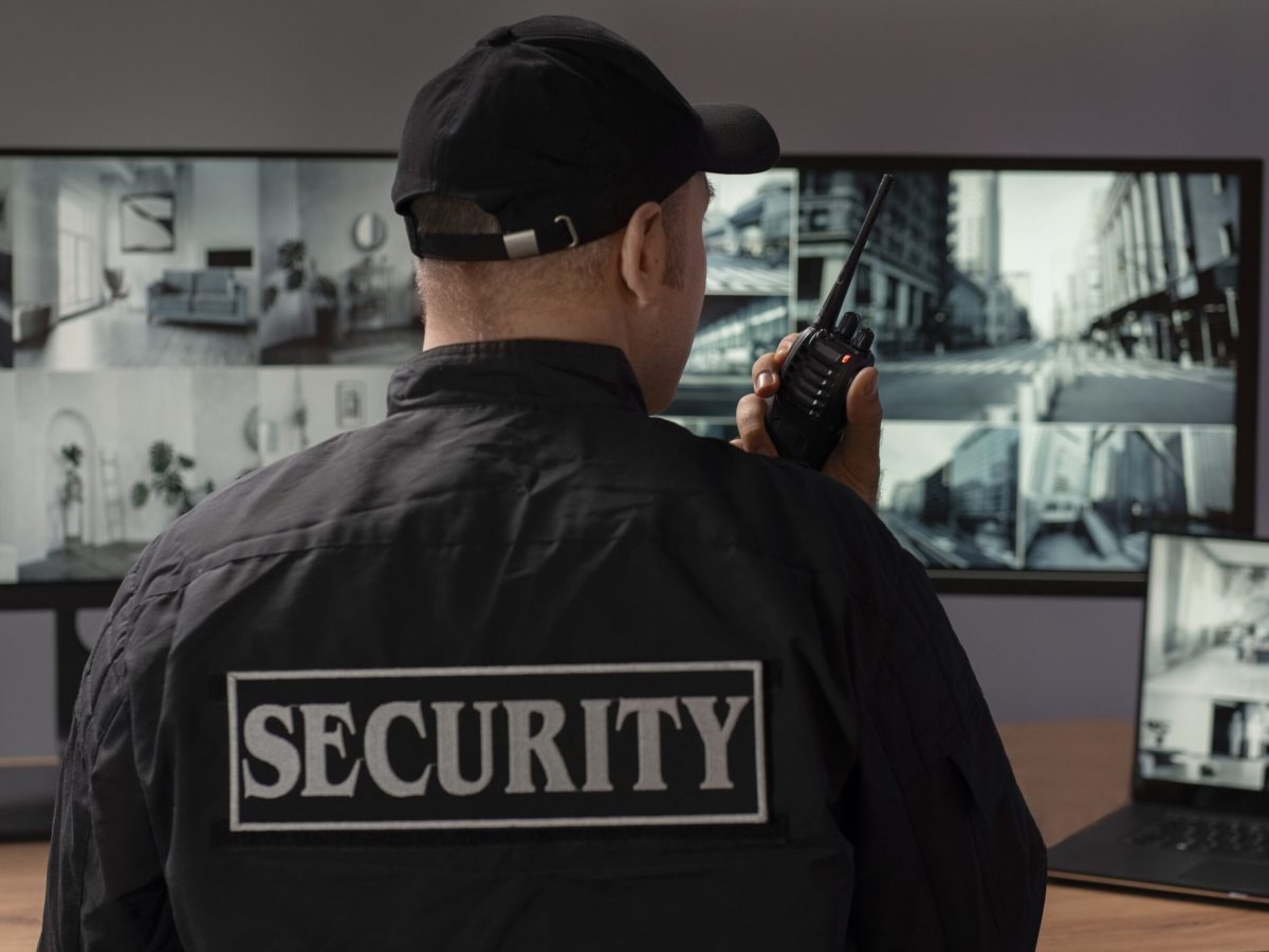 portrait-male-security-guard-with-radio-station-camera-screens (1) portrait-male-security-guard-with-radio-station-camera-screens (1)